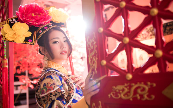 A Taiwanese woman dressed in traditional Chinese costume, styled as Qián Fūrén, posed beside an ornate red lantern in a vibrant 4K Ultra HD background.