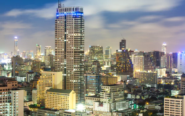 Bangkok skyline at night, Thailand — illuminated man-made high-rises and sprawling city lights rendered in 8K Ultra HD as a PC desktop wallpaper and background.