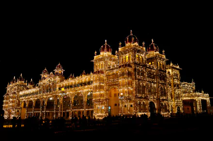 Mysore Palace illuminated at night in Karnataka, India, showcasing intricate architecture and vibrant lights, captured in stunning 4K Ultra HD resolution.