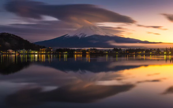 HD wallpaper of Mount Fuji reflected in Lake Kawaguchi at dusk, Yamanashi, Japan, highlighting a serene landscape with vibrant sunset colors.
