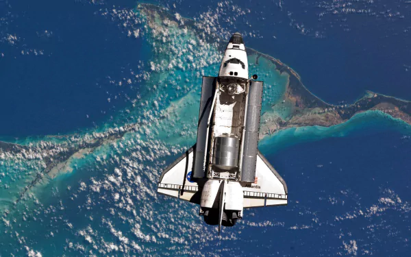 A stunning HD image of the Space Shuttle Atlantis captured from space by NASA, showcasing the vehicle above vibrant ocean hues and intricate landforms.