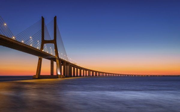 Man Made Vasco da Gama Bridge Bridges Portugal Bridge Sea Sunset HD Wallpaper | Background Image