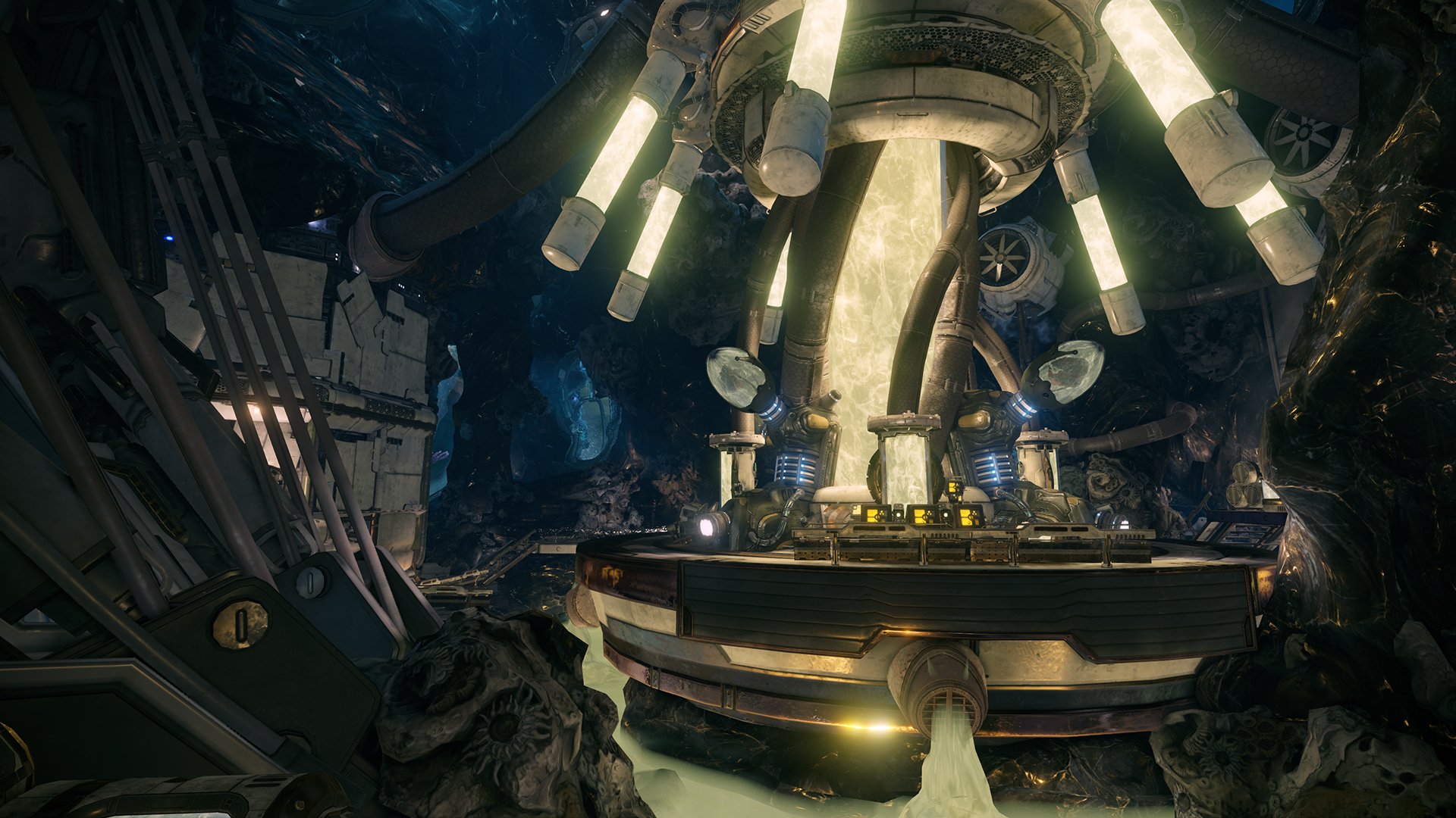 HD PC desktop wallpaper from the video game Warframe, featuring a futuristic, illuminated structure inside a dark, cavernous environment.