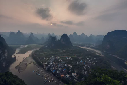Sunset over the river and mountains at Laozhai Mountain, Guangxi Zhuang, China, captured in a 4K Ultra HD landscape photograph.