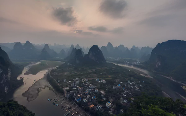 Sunset over the river and mountains at Laozhai Mountain, Guangxi Zhuang, China, captured in a 4K Ultra HD landscape photograph.