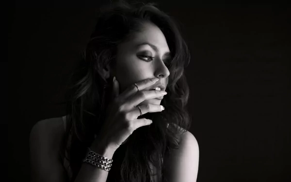 Black and white 4K Ultra HD image of a female model with an expressive mood, captured in soft light and shadow for a striking PC desktop wallpaper background.