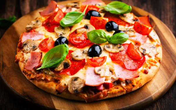 Delicious pizza topped with fresh vegetables and herbs, served on a wooden board. Perfect desktop wallpaper for food lovers, showcasing a vibrant meal.