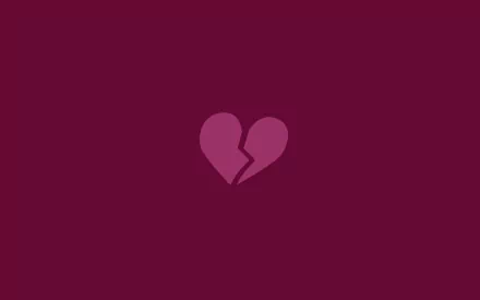 HD desktop wallpaper featuring a broken heart symbol on a deep purple background, expressing the theme of love.