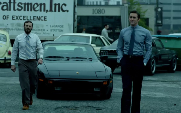 HD desktop wallpaper featuring Joe MacMillan and Gordon Clark from 'Halt and Catch Fire' standing beside a car with a vintage backdrop.