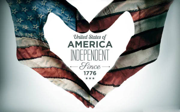 A patriotic 4th of July wallpaper featuring hands shaped into a heart, adorned with the American flag, and the text celebrating American independence since 1776.