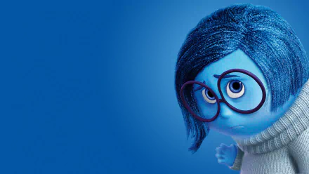 A vibrant HD wallpaper featuring Sadness from the movie *Inside Out*, showcasing her distinctive blue appearance and thoughtful expression against a solid blue background.