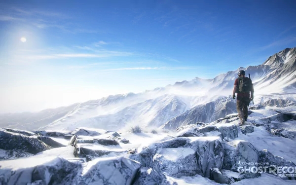 HD desktop wallpaper featuring stunning snowy mountain scenery from the video game Tom Clancy's Ghost Recon Wildlands, showcasing a lone character exploring the icy landscape under a clear blue sky.
