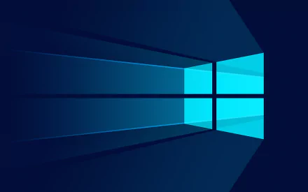 HD desktop wallpaper featuring a stylized Windows 10 logo in blue tones, designed with geometric shapes and a dark background.