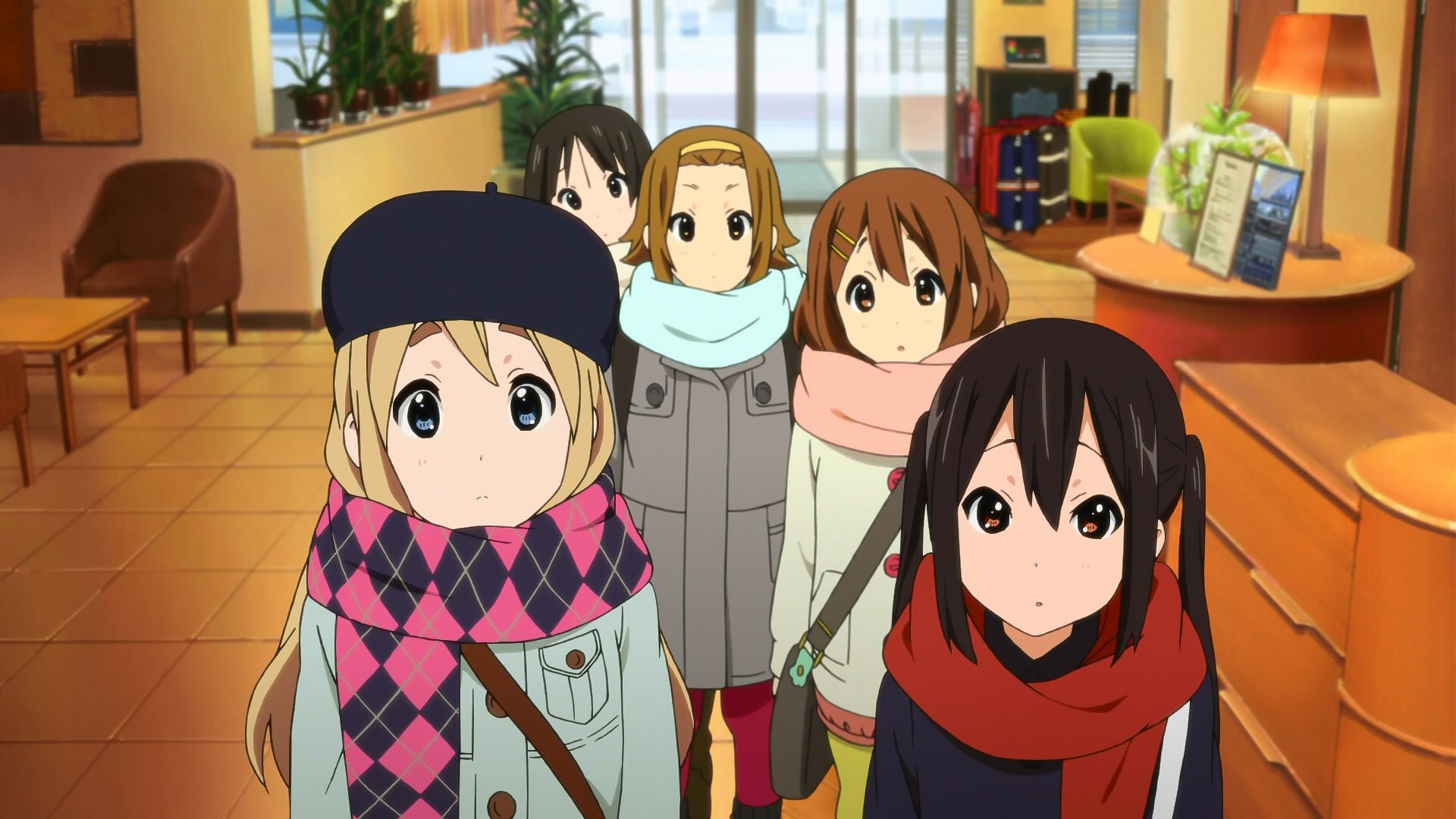 HD PC desktop wallpaper featuring Azusa Nakano, Tsumugi Kotobuki, Ritsu Tainaka, Yui Hirasawa, and Mio Akiyama from the anime K-ON! dressed in winter scarves indoors.