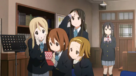 Anime HD desktop wallpaper featuring K-ON! characters Tsumugi Kotobuki, Mio Akiyama, Yui Hirasawa, Azusa Nakano, and Ritsu Tainaka in school uniforms with skirts.