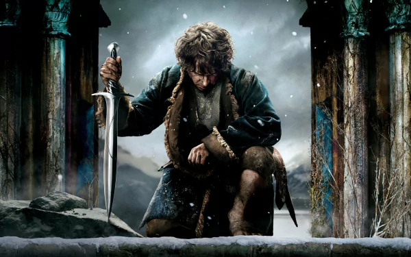 4K Ultra HD desktop wallpaper featuring a dramatic scene from the movie The Hobbit: The Battle of the Five Armies with a warrior kneeling, gripping a sword amidst ancient ruins.