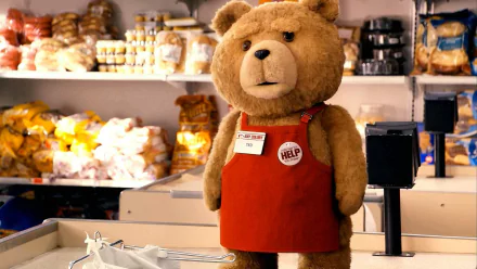 HD PC desktop wallpaper featuring Ted, the iconic movie character, standing behind a store counter wearing a red apron with a HELP button.