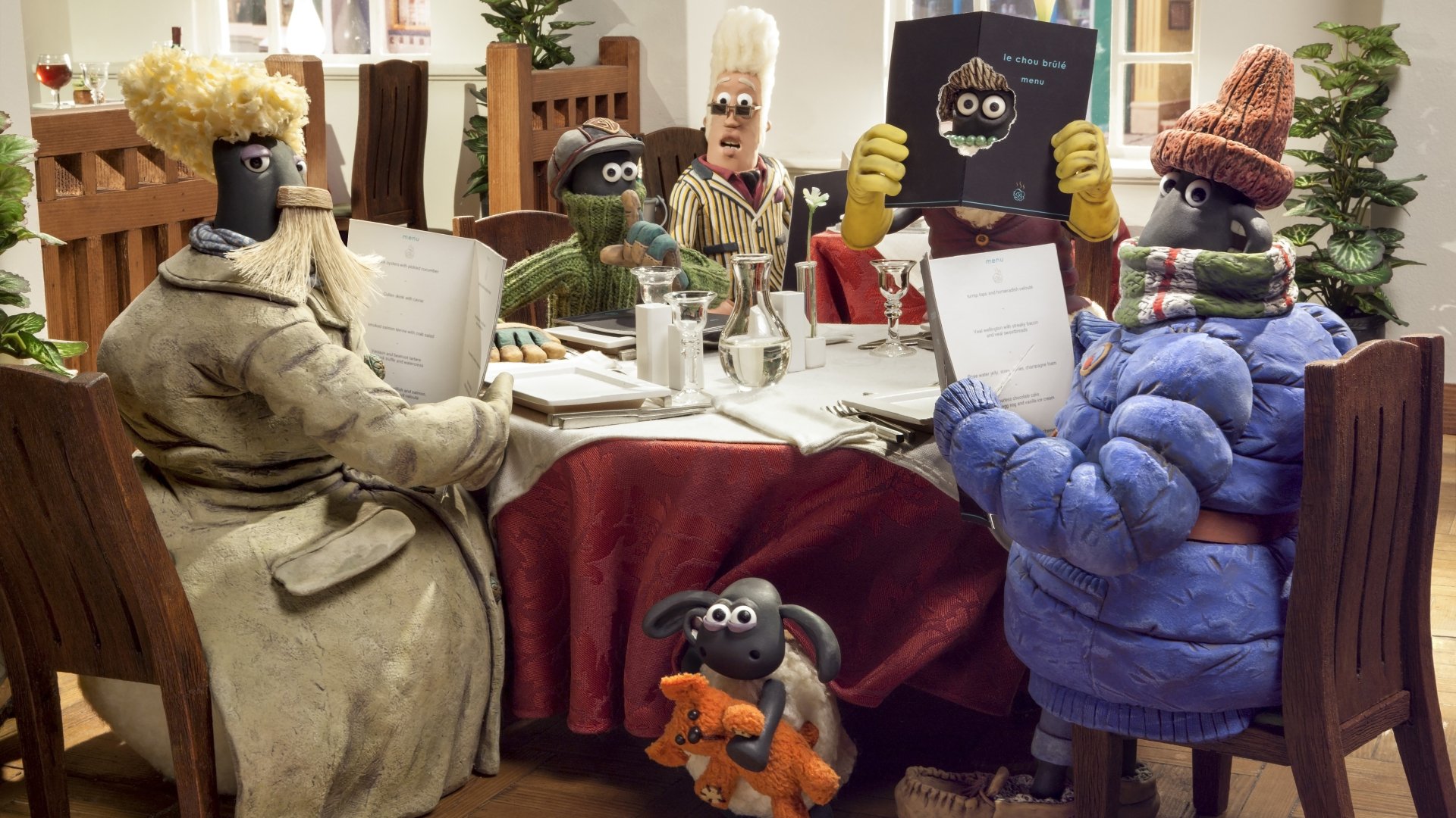 Shaun the Sheep Movie 4K Ultra HD PC desktop wallpaper: claymation scene of Shaun and friends gathered around a cozy dining table, bundled in coats and scarves.