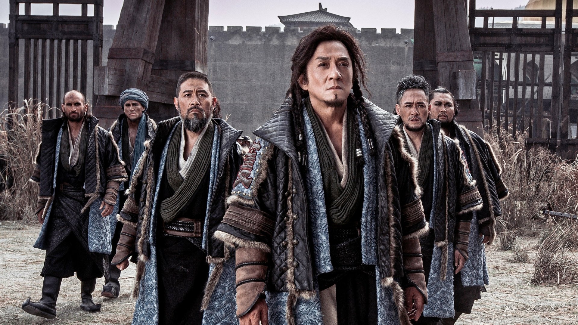 HD PC desktop wallpaper featuring a scene from the movie Dragon Blade with five warriors walking confidently in front of an ancient fortress.