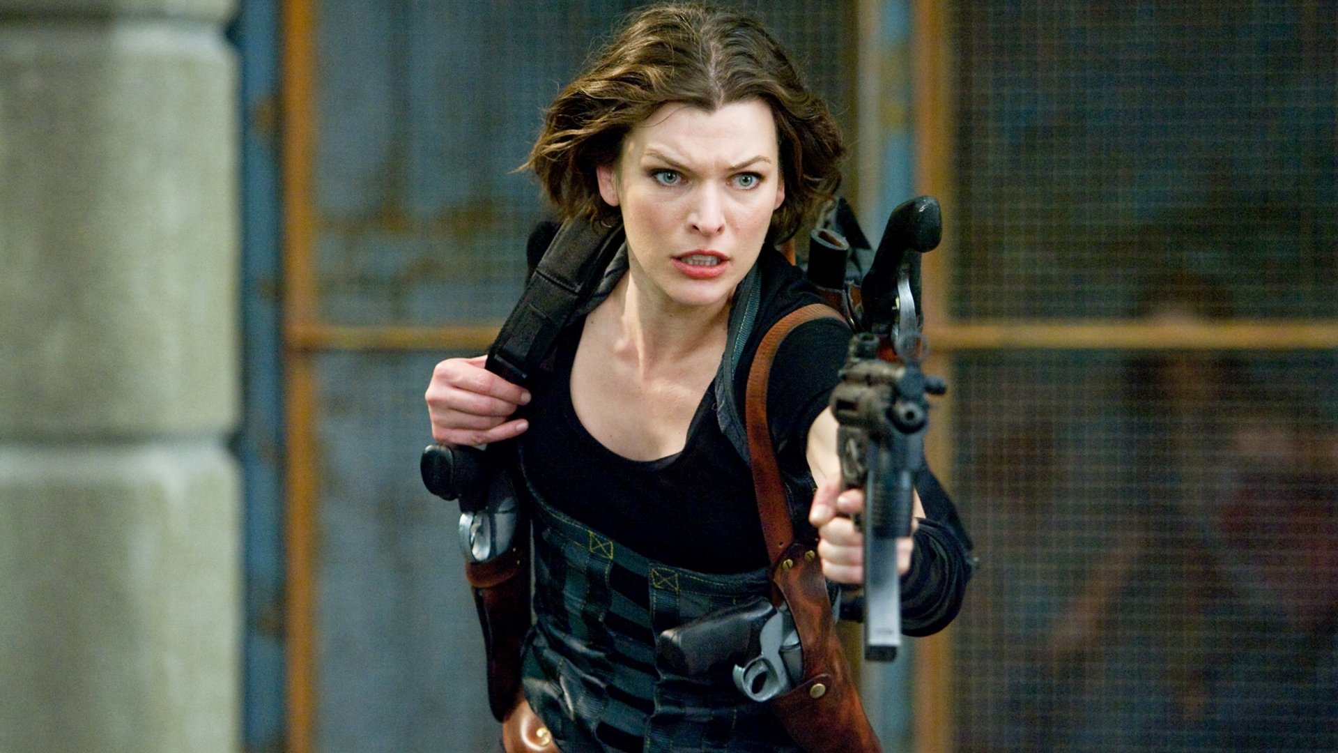 HD desktop wallpaper featuring Milla Jovovich in action from the movie Resident Evil: Afterlife, aiming her gun with intense focus.