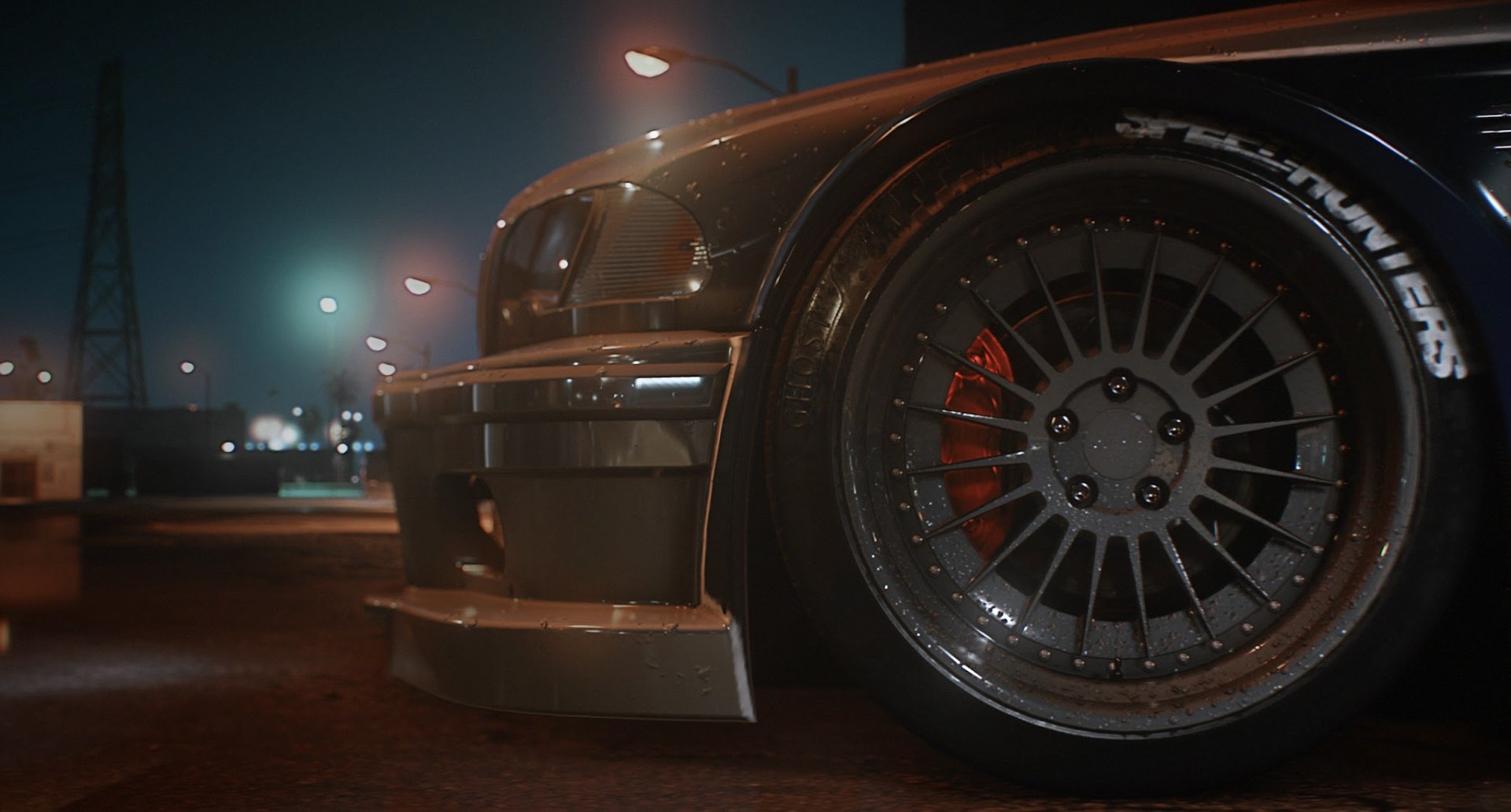 HD desktop wallpaper featuring a close-up of a sleek car's wheel and body from Need For Speed (2015), set against a dimly lit urban backdrop.