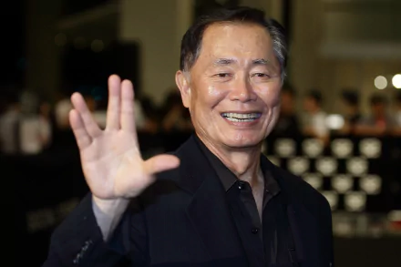 HD wallpaper featuring George Takei smiling and waving, suitable as a desktop background.