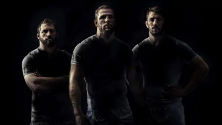 Three England rugby players pose dramatically against a dark background, highlighting the intensity of the Rugby World Cup 2015 in this 4K Ultra HD sports wallpaper.