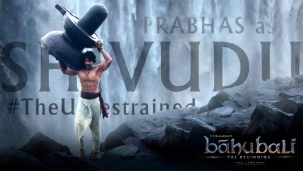 HD PC desktop wallpaper featuring Prabhas as Shivudu from the movie Baahubali: The Beginning, showcasing him lifting a massive Shivling against a waterfall backdrop.
