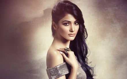 A captivating HD wallpaper featuring celebrity Pooja Hegde, showcasing her striking beauty and elegance against a soft, blurred background.