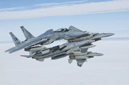 Four McDonnell Douglas F-15 Eagle fighter jets fly in formation above the clouds, captured in a 4K Ultra HD military desktop wallpaper.