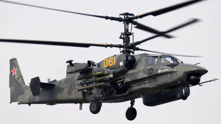 A Kamov Ka-50 helicopter in flight, showcasing its military capabilities. This HD desktop wallpaper highlights the impressive design of the Kamov Ka-52 Alligator variant.