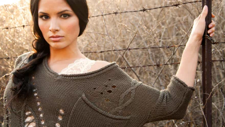 HD PC desktop wallpaper featuring celebrity Katrina Law posing against a rustic backdrop with a neutral-tone knit sweater and braided hairstyle.