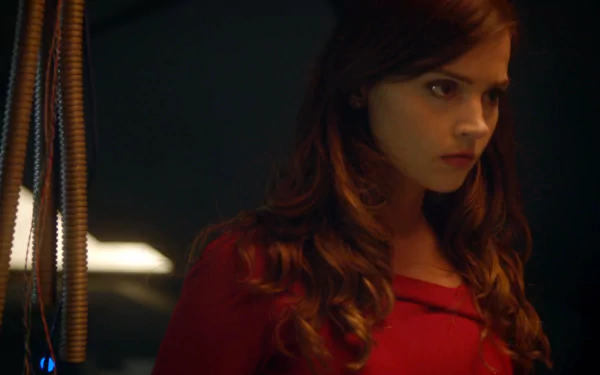 Clara Oswald, portrayed by Jenna Coleman in the TV show Doctor Who (2005), shown in a dramatic close-up scene for a HD desktop wallpaper background.