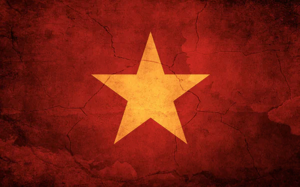 HD desktop wallpaper featuring the Vietnam flag with a large yellow star on a textured, cracked red background.