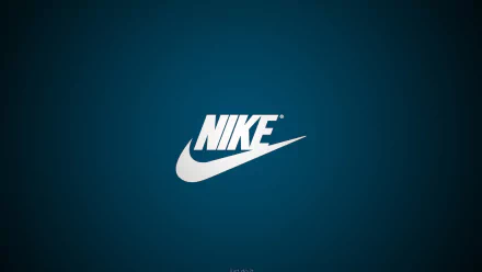 HD desktop wallpaper featuring the iconic Nike logo in white against a deep blue background, embodying a contemporary and dynamic design.