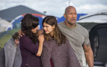 Dwayne Johnson, Alexandra Daddario, and Carla Gugino share a tense moment in a scene from the movie San Andreas, captured in this striking HD desktop wallpaper.