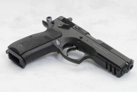 Man-made CZ 75 SP-01 pistol photographed on a light surface, presented as a 2K Quad HD PC desktop wallpaper and background.
