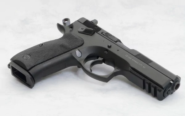 Man-made CZ 75 SP-01 pistol photographed on a light surface, presented as a 2K Quad HD PC desktop wallpaper and background.