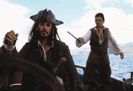 Jack Sparrow and Will Turner, played by Johnny Depp and Orlando Bloom, navigate the seas in this HD wallpaper from Pirates of the Caribbean: The Curse of the Black Pearl.