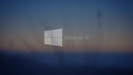 A serene HD desktop wallpaper featuring the Windows 10 logo against a soft, blurred background, showcasing Microsoft's sleek technology and design aesthetics.