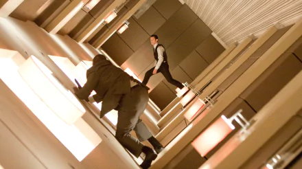HD desktop wallpaper featuring Joseph Gordon-Levitt from the movie Inception in a gravity-defying hallway fight scene.