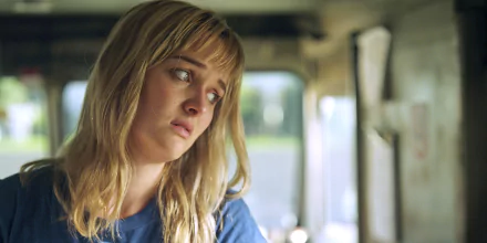 HD desktop wallpaper featuring Jess Weixler from the movie Free Samples, showing a contemplative expression inside a softly lit vehicle.