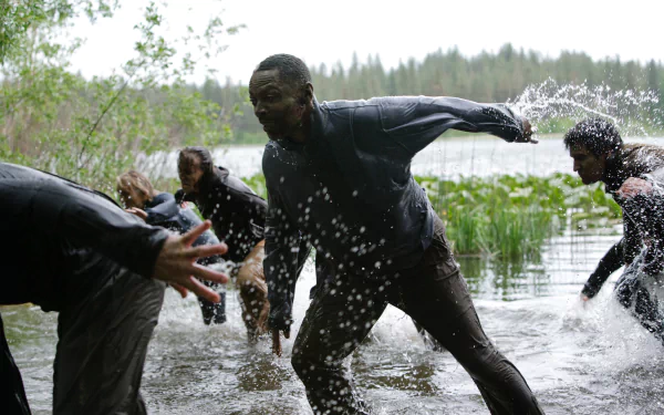4K Ultra HD desktop wallpaper featuring a dynamic scene from the TV show Z Nation with characters splashing through a swampy, forested wetland.