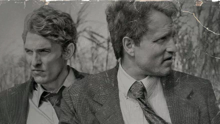 A dramatic black-and-white image of Woody Harrelson and Matthew McConaughey in a scene from the TV show True Detective, showcasing their intense expressions and gritty atmosphere.