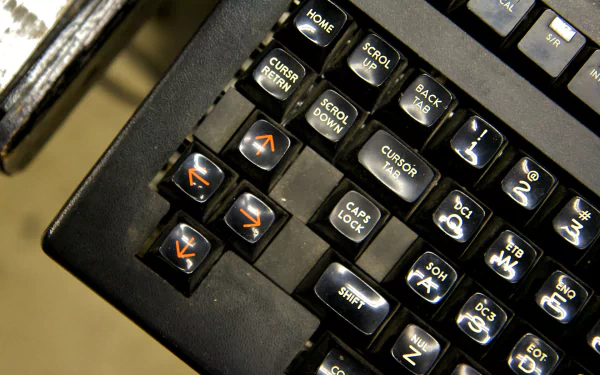 Close-up of a computer keyboard, showcasing various keys and symbols. This HD PC desktop wallpaper emphasizes technology in an engaging, detailed manner.