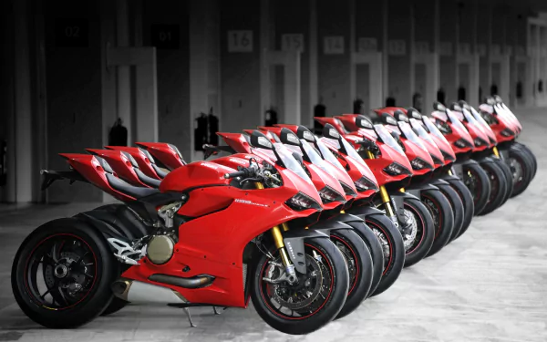 HD PC desktop wallpaper/background: row of red Ducati 1199 sportbike vehicles lined up in a garage, angled toward the viewer.