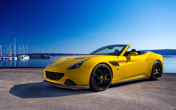 HD desktop wallpaper of a luxury yellow Ferrari California T convertible parked by a marina under a clear blue sky.