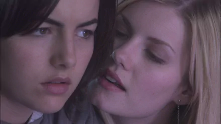A captivating HD wallpaper from the movie The Quiet, featuring Camilla Belle and Elisha Cuthbert in an intense moment. The image highlights their compelling expressions and emotional connection.