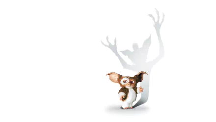 HD PC desktop wallpaper featuring Gizmo from the movie Gremlins with a shadow of a menacing gremlin behind him on a white background.