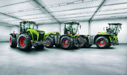 A showcase of Claas vehicles in a spacious indoor setting, featuring three modern tractors displayed prominently. This image serves as an 8K Ultra HD PC desktop wallpaper.
